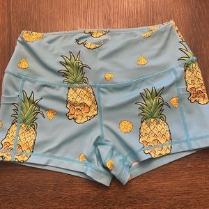 6 pairs of Feed Me Fight Me workout shorts